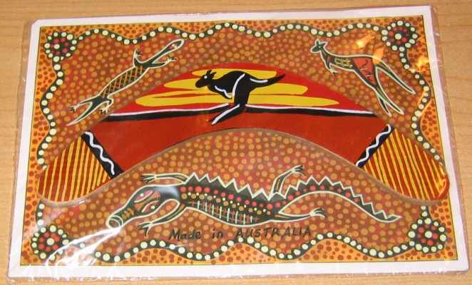 Small souvenir boomerang on Aboriginal dot art card