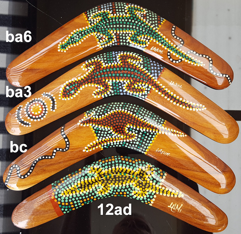 Aboriginal art wooden boomerangs. Animal dot art by Lami. Brigalow wood